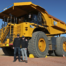 NMG executives with Caterpillar’s first battery electric 793 large mining truck demonstrated at Caterpillar’s Tucson Proving Ground in Arizona