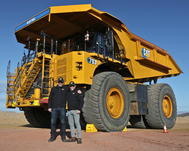 NMG executives with Caterpillar’s first battery electric 793 large mining truck demonstrated at Caterpillar’s Tucson Proving Ground in Arizona